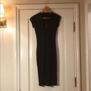 Tight black women’s dress.